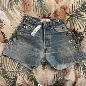 Vintage denim shorts. Stainless steel chain detail with exposed hip. Button fly